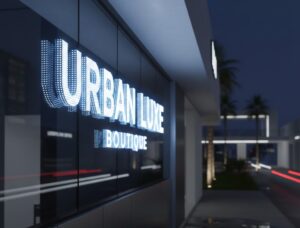 Signboard LED 3D menyala terang pada waktu malam di kawasan kedai moden.